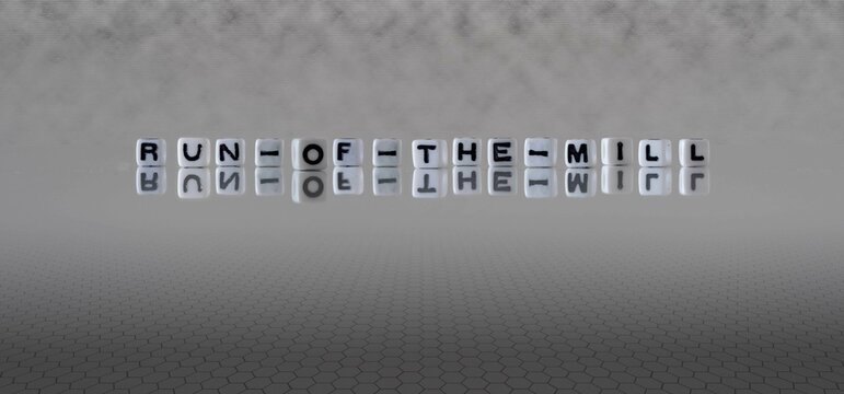 run of the mill word or concept represented by black and white letter cubes on a grey horizon background stretching to infinity