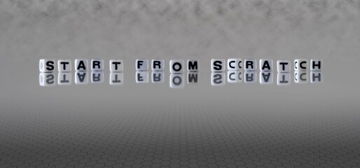 start from scratch word or concept represented by black and white letter cubes on a grey horizon...