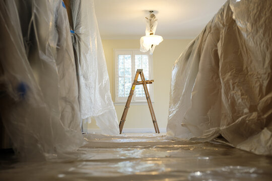 Room Covered in Plastic to Prepare for Home Renovation Project