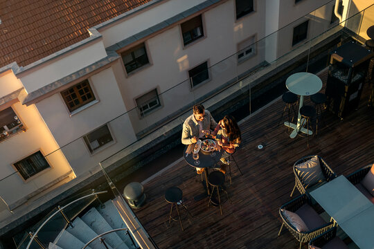 Loving couple enjoying romantic date on rooftop