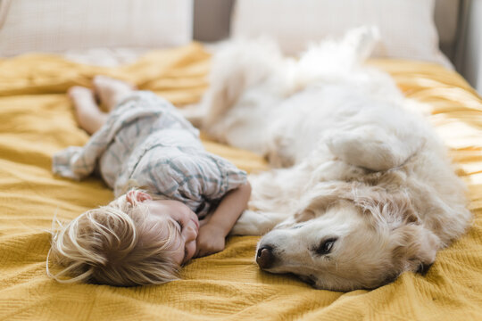girl saying goodbye to dog