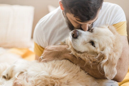 A man saying goodbye to his dog