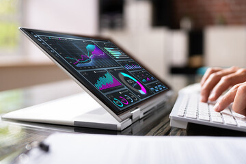 Financial Analyst Using Convertible Laptop Screen