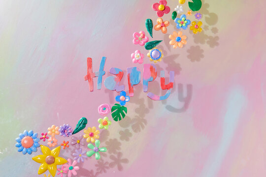 Beautiful bloom flowers with "Happy" word