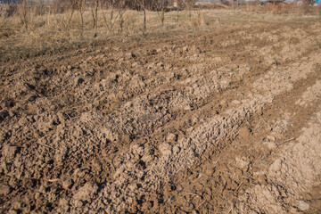 Plowed land in the spring. Beds in the garden.