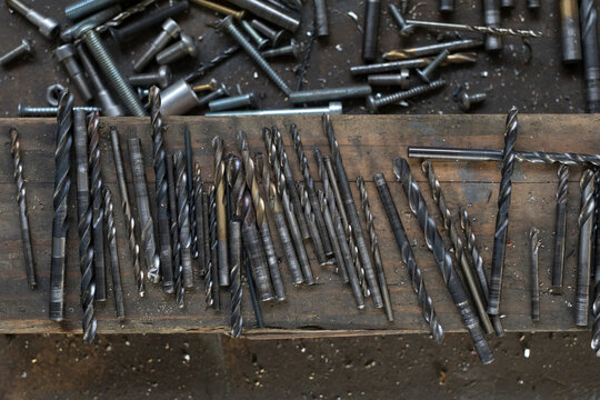 drill bits with screws, nails and blacksmith tools