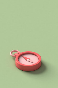 a pink compass on a green background with copy space