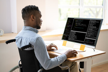 African American Coder Using Computer At Desk