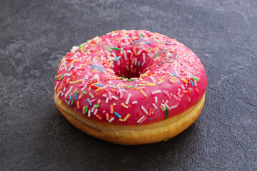 Sweet glazed struwberry donut with icing