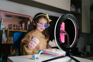 Trendy girl recording video for social media blog