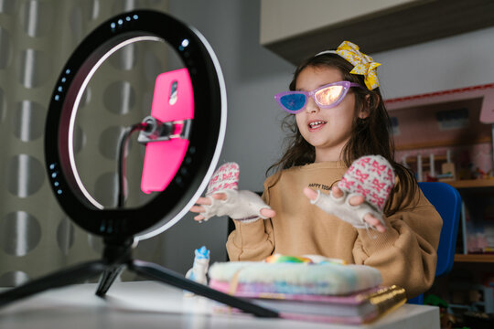 Adorable child shooting video for social media