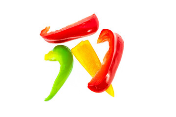 Sliced tricolor pepper with chopsticks, on a white background