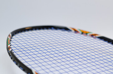 Close up of badminton racket over the white background