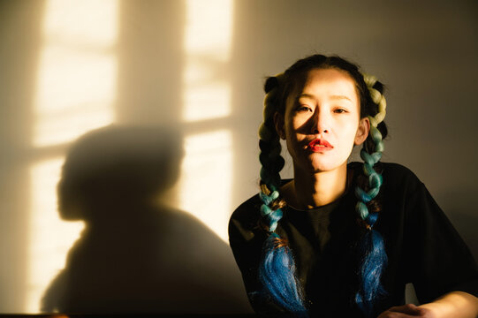 An asian young woman with fancy hairstyle