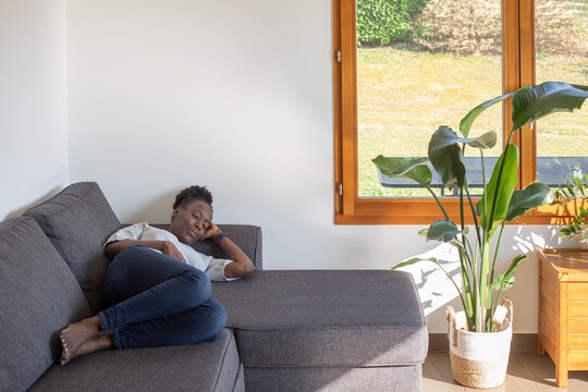 Black Woman Taking A Nap On The Couch At Home, Having Rest, Sleep