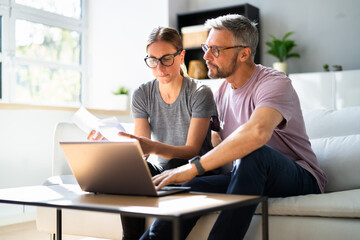 Couple Doing Taxes And Family Budget
