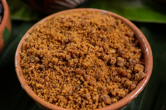 Ground piloncillo or sugar cane inside a clay pot 