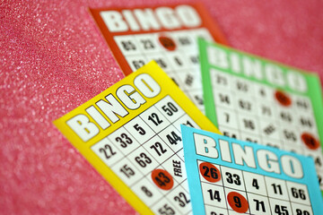 Many colorful bingo boards or playing cards for winning chips. Classic US or canadian five to five...