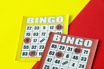 Yellow and red bingo boards or playing cards for winning chips. Classic US or canadian five to five bingo cards on bright background