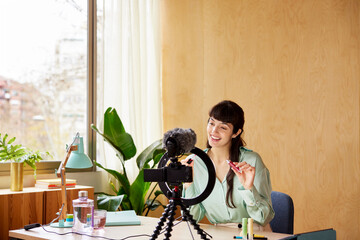 Beauty blogger shooting video at home