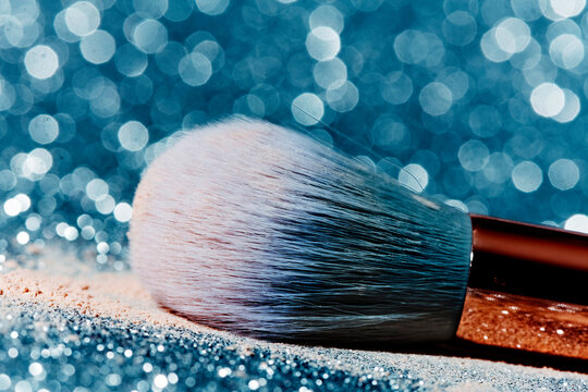 make-up brush on a blue surface