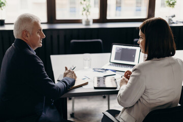 coworkers discussing data during meeting