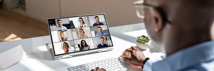 Businessman Videoconferencing On Laptop - obrazy, fototapety, plakaty