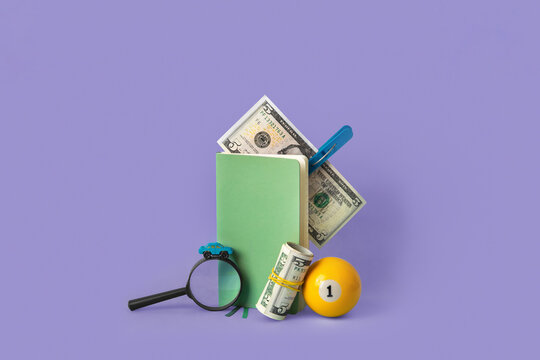 Copybook, magnifier, billiard ball and money