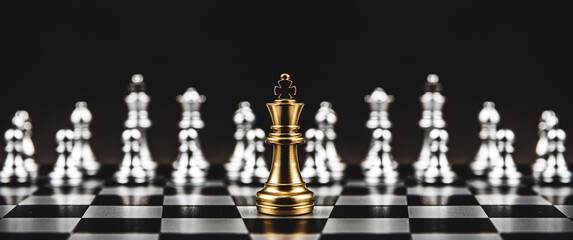 Close-up king chess stand first on chessboard concepts of leader teamwork volunteer challenge of business team or wining and leadership strategy and organization risk management or team player.