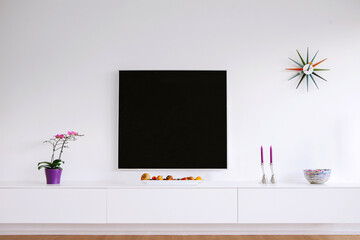 Picture Frame Flat Screen TV on wall in living room 