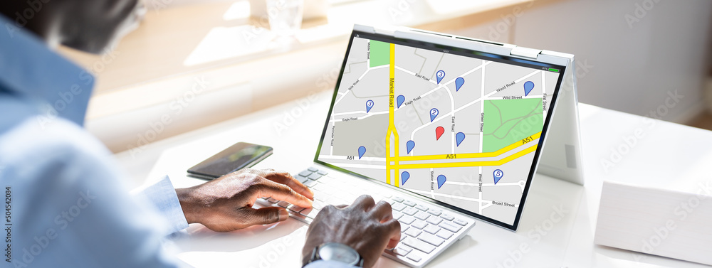Poster close-up of a man`s hand using gps navigation map