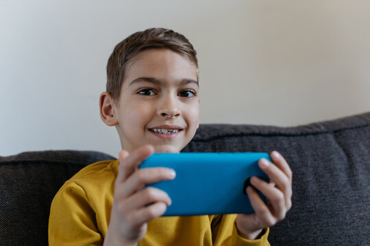 Kid looking at his phone