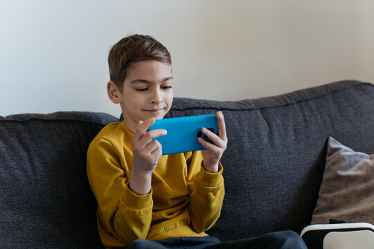 Kid looking at his phone