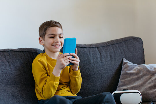 Kid looking at his phone