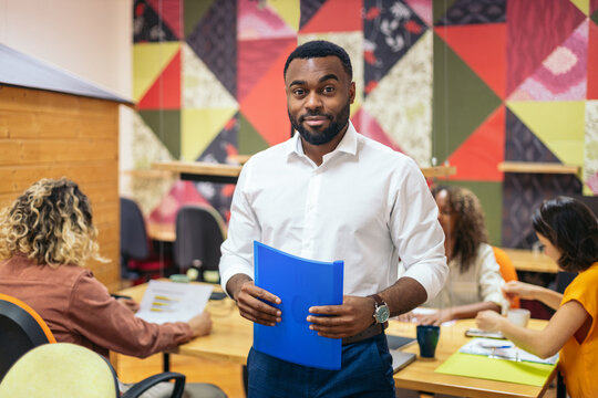 Portrait of young worker in a modern office