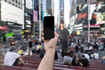 Guy is admiring view at Time Squares from steps