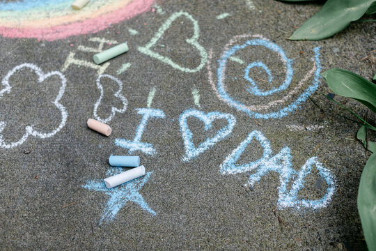 Colorful Sidewalk Chalk with Loving Message for Dad