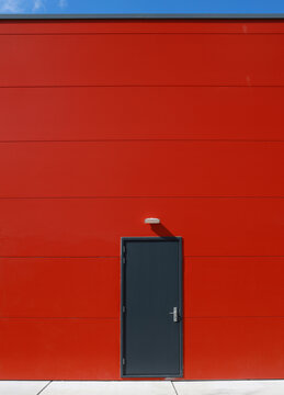 door in red wall