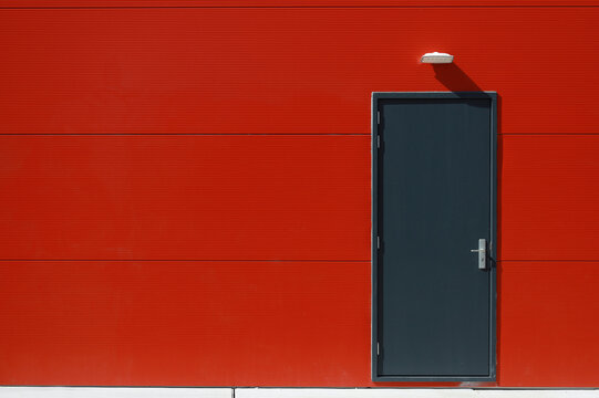 door in red wall