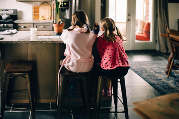 sisters sitting side by side