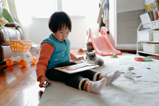 Asian baby playing with puzzles