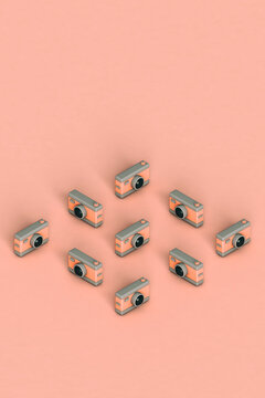 3d rnedering of set of pink abstract cameras with copy space