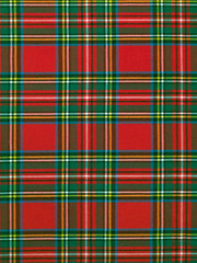 classic tartan fabric with red squares and green and blue and yellow stripes, textile background