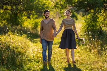 Fototapeta premium happy young couple walking in nature