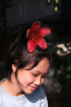 Closeup Asian girl playing with kapok