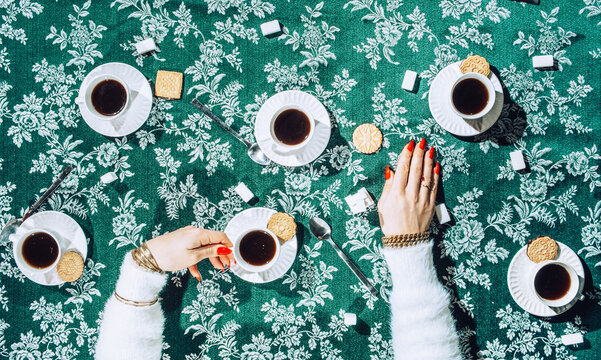 Female drinking coffee look from above.