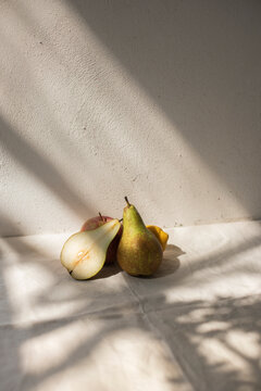 Still-life of some fruit lit by the sunlight