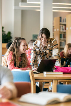 Student Friends Working Together On Laptop