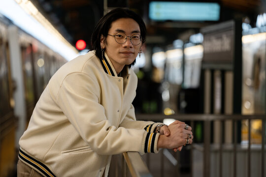 Smiling young man by the train
