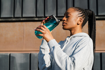 Sportswoman Drinking Water, Relaxing